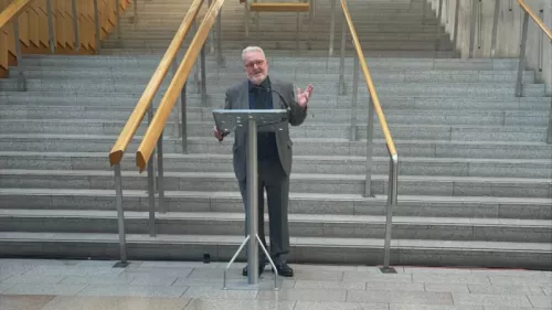 Fred Drummond presenting at Holyrood, Parliament