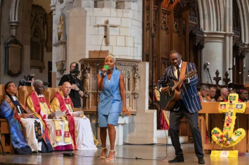 Two artists performing at the Windrush 75 anniversary